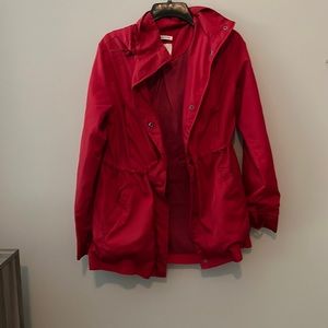 Red rain jacket with jersey knit interior and cinched waist